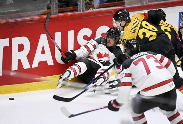 Max Comtois (left) and Noah Gregor of Canada and Fabio Wagner of Germany during the 2022 IIHF Ice hockey, Eishockey World Championships preliminary round group A match between Germany and Canada in Helsinki on May 13th, 2022. Helsinki Finland LKLAPA20220513214740B416  Copyright: xAnttixAimo-Koivistox