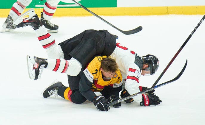 Maximilian Kastner Nr.7 of Germany compete, fight for the puck against, Morgan Geekie Nr. 16 of Canada in the match GERMANY - CANADA IIHF Ice hockey, Eishockey World Championship, WM, Weltmeisterschaft Group B in Helsinki, Finland, May 13, 2022, Season 2021 2022