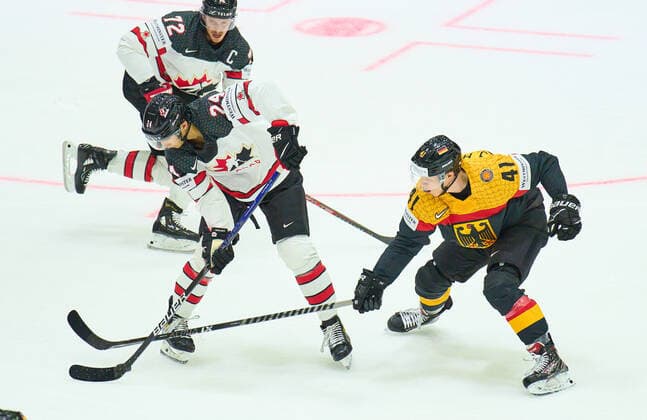 Jonas Mueller, Müller Nr. 41 of Germany compete, fight for the puck against, Dylan Cozens Nr. 24 of Canada Thomas Chabot Nr. 72 of Canada in the match GERMANY - CANADA 3-5 IIHF Ice hockey, Eishockey World Championship, WM, Weltmeisterschaft Group B in Helsinki, Finland, May 13, 2022, Season 2021 2022