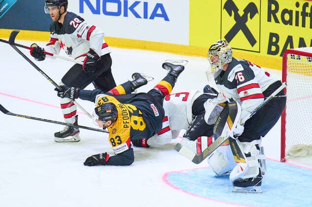 Leonard Leo Pföderl Nr. 83 of Germany compete, fight for the puck against, Logan Thompson Nr. 36 of Canada Damon Severson Nr. 28 of Canada in the match GERMANY - CANADA 3-5 IIHF Ice hockey, Eishockey World Championship, WM, Weltmeisterschaft Group B in Helsinki, Finland, May 13, 2022, Season 2021 2022