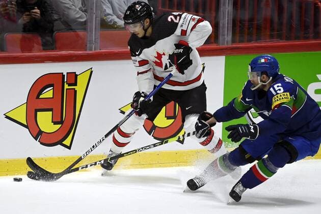Dylan Cozens (L) of Canada vies with Enrico Miglioranzi of Italy during the 2022 IIHF Ice hockey, Eishockey World Championships preliminary round group A match between Italy and Canada in Helsinki on May 15, 2022. Helsinki Finland LKFTJK20220515132939EGTW  Copyright: xAnttixAimo-Koivistox
