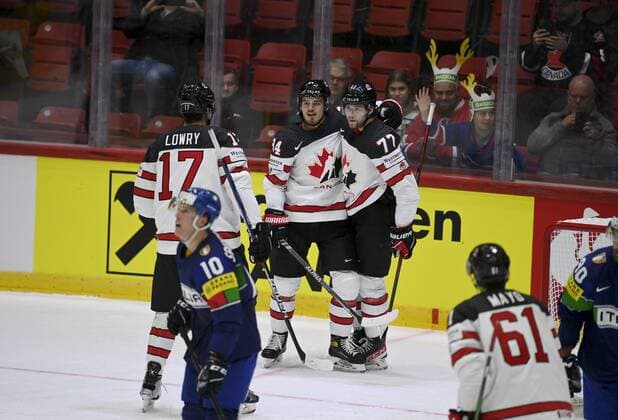 Adam Lowry (L), Cole Sillinger and Josh Anderson of Team Canada celebrate 1-2 goal during the 2022 IIHF Ice hockey, Eishockey World Championships preliminary round group A match between Italy and Canada in Helsinki on May 15, 2022. Helsinki Finland LKFTJK20220515132350QTYV  Copyright: xAnttixAimo-Koivistox