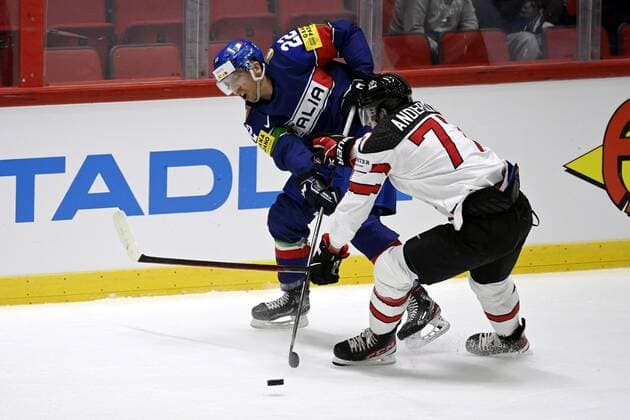 Diego Kostner (L) of Italy vies with Josh Anderson of Canada during the 2022 IIHF Ice hockey, Eishockey World Championships preliminary round group A match between Italy and Canada in Helsinki on May 15, 2022. Helsinki Finland LKFTJK20220515132748HPZR  Copyright: xAnttixAimo-Koivistox