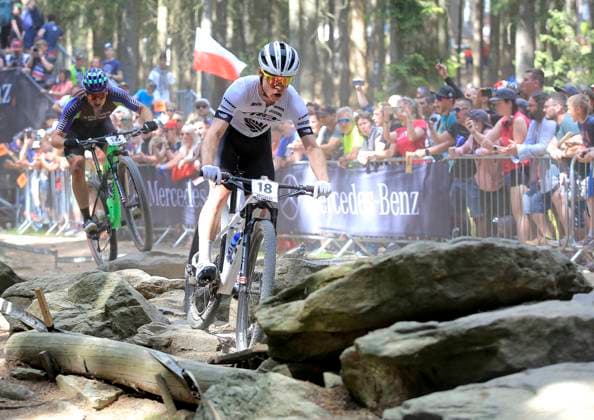 Anton Cooper (NZL), right, and Luca Schwarzbauer (GER) compete in the UCI MTB World Cup, Cross-Country Men Elite, in Nove Mesto na Morave, Czech Republic, on May 15, 2022. (CTKxPhoto LiborxPlihal) CTKPhotoP2022051505885  PLI 25