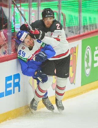 Zach Whitecloud Nr. 2 of Canada compete, fight for the puck against, Samuel Takac, SVK 49 in the match SLOVAKIA - CANADA of the IIHF Ice hockey, Eishockey World Championship, WM, Weltmeisterschaft Group B in Helsinki, Finland, May 16, 2022, Season 2021 2022
