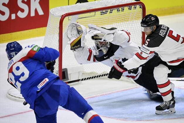 Michal Ivan of Slovakia and Logan Thompson (left) and Nick Holden of Canada during the 2022 IIHF Ice hockey, Eishockey World Championships preliminary round group A match between Slovakia and Canada in Helsinki on May 16, 2022. Helsinki Finland LKLAPA20220516174130X462  Copyright: xAnttixAimo-Koivistox