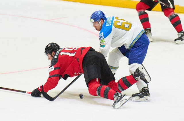 Drake Batherson Nr. 19 of Canadacompete, fight for the puck against, Dmitriy Gurkov Nr.68 of Kazakhstan in the match CANADA - KAZAKHSTAN of the IIHF Ice hockey, Eishockey World Championship, WM, Weltmeisterschaft Group B in Helsinki, Finland, May 19, 2022, Season 2021 2022