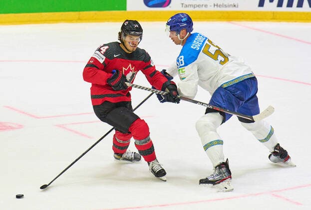Cole Sillinger Nr. 34 of Canada compete, fight for the puck against, Viktor Svedberg Nr. 58 of Kazakhstan in the match CANADA - KAZAKHSTAN of the IIHF Ice hockey, Eishockey World Championship, WM, Weltmeisterschaft Group B in Helsinki, Finland, May 19, 2022, Season 2021 2022