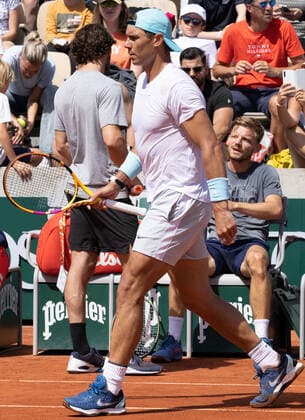 Spanish Rafael Nadal, passes by and Belgian David Goffin during a training session ahead of the Roland Garros French Open tennis tournament, in Paris, France, Saturday 21 May 2022. This year s tournament takes place from 22 May to 5 June. BENOITxDOPPAGNE  x35349284x
