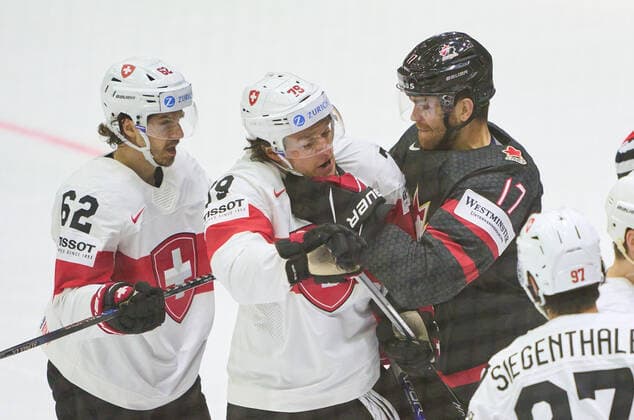 Adam Lowry Nr. 17 of Canada fight against Calvin Thürkauf, SUI 79 Denis Malgin, SUI 62 in the match CANADA - SWITZERLAND of the IIHF Ice hockey, Eishockey World Championship, WM, Weltmeisterschaft Group B in Helsinki, Finland, May 21, 2022, Season 2021 2022