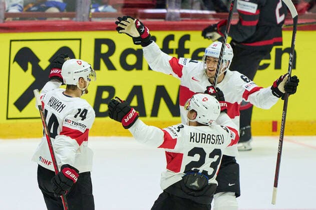 Dean Kukan, SUI 14 celebrates his goal, happy, laugh, celebration, 2-2 with Philipp Kurashev Nr. 23 of Switzerland Fabrice Herzog Nr. 61 of Switzerland in the match CANADA - SWITZERLAND of the IIHF Ice hockey, Eishockey World Championship, WM, Weltmeisterschaft Group B in Helsinki, Finland, May 21, 2022, Season 2021 2022