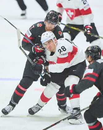 Timo Meier Nr. 28 of Switzerland compete, fight for the puck against, Adam Lowry Nr. 17 of Canada in the match CANADA - SWITZERLAND of the IIHF Ice hockey, Eishockey World Championship, WM, Weltmeisterschaft Group B in Helsinki, Finland, May 21, 2022, Season 2021 2022