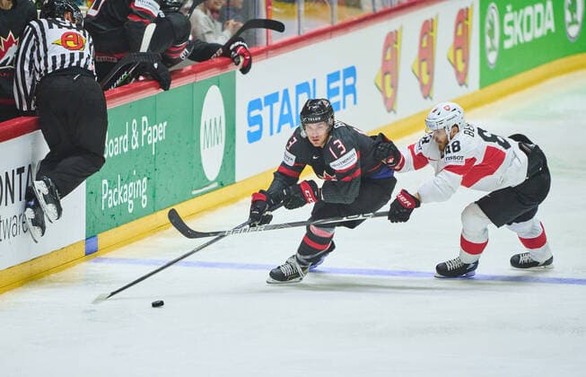Matt Barzal Nr. 13 of Canada compete, fight for the puck against, Christoph Bertschy Nr. 88 of Switzerland in the match CANADA - SWITZERLAND of the IIHF Ice hockey, Eishockey World Championship, WM, Weltmeisterschaft Group B in Helsinki, Finland, May 21, 2022, Season 2021 2022