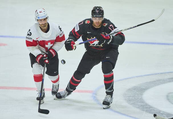 Denis Malgin, SUI 62 compete, fight for the puck against, Adam Lowry Nr. 17 of Canada in the match CANADA - SWITZERLAND of the IIHF Ice hockey, Eishockey World Championship, WM, Weltmeisterschaft Group B in Helsinki, Finland, May 21, 2022, Season 2021 2022