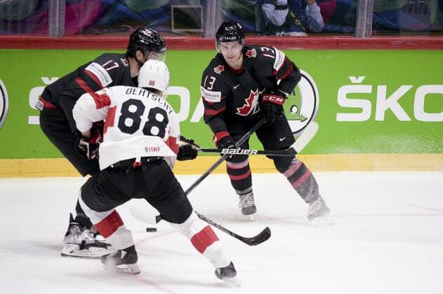 Christoph Bertschy of Sweitzerland vies the puck with Adam Lowry and Matt Barzal (R) of Canada during the 2022 IIHF Ice hockey, Eishockey World Championships preliminary round group A match between Canada and Switzerland in Helsinki on May 21, 2022. Helsinki Finland LKFTVX20220521191350DUZL  Copyright: xMikkoxStigx
