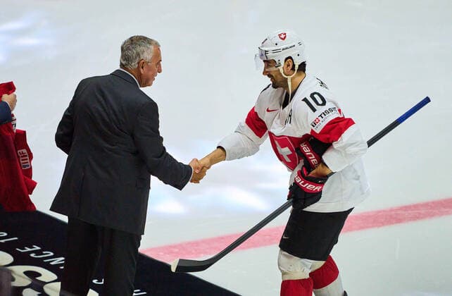 Luc Tardif, president of the IIHF federation congrats Andres Ambühl Nr. 10 of Switzerland for in the match CANADA - SWITZERLAND 3-6 of the IIHF Ice hockey, Eishockey World Championship, WM, Weltmeisterschaft Group B in Helsinki, Finland, May 21, 2022, Season 2021 2022