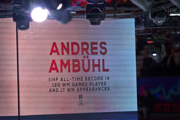 Luc Tardif, president of the IIHF federation congrats Andres Ambühl Nr. 10 of Switzerland for IIHF All-Time record with 120 WM, WC games played and 17 WM appearances in the match CANADA - SWITZERLAND 3-6 of the IIHF Ice hockey, Eishockey World Championship, WM, Weltmeisterschaft Group B in Helsinki, Finland, May 21, 2022, Season 2021 2022