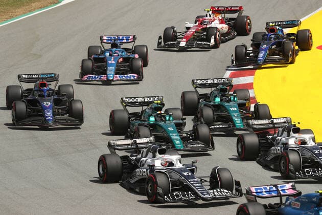 22nd May 2022; Barcelona, Circuit de Barcelona Catalunya, Spain; F1 Grand Prix of Spain, Race Day; Aston Martin Aramco Cognizant F1 Team, Sebastian Vettel battles through turn 1  ActionPlus12391947 Octane