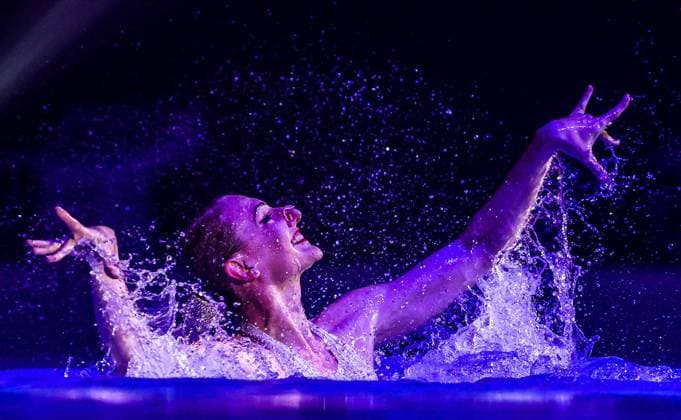 MOSCOW, RUSSIA â€“ MAY 22, 2022: Seven-time Olympic champion Svetlana Romashina performs a women s solo routine during the Zavorazhivayushchaya Krasota Mesmerising Beauty Festival featuring synchronised swimming stars at Dynamo Sports Palace. Sergei Bobylev TASS  TS13252F