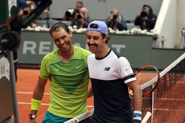 Sport Bilder des Tages Fifth seeded Rafael Nadal of Spain and Australian Jordan Thompson (R) share a pat on the back at the end of their French Tennis Open match at Roland Garros near Paris, France, on Monday May 23, 2022. Nadal won 6-2, 6-2, 6-2.  PAR20220523129 MAYAxVIDON-WHITE
