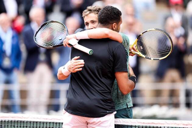 TENNIS - French Open 2022 PARIS,FRANCE,24.MAY.22 - TENNIS - ATP, Tennis Herren World Tour, French Open, Roland Garros, Grand Slam. Image shows Jo-Wilfried Tsonga (FRA) and Casper Ruud (NOR).  GEPAxpictures xPatrickxSteiner