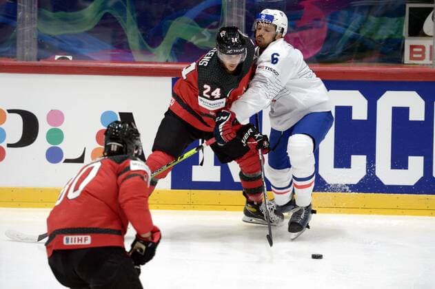 Dylan Cozens of Canada vies with Vincent Llorca (R) of France during the 2022 IIHF Ice hockey, Eishockey World Championships preliminary round group A match between Canada and France in Helsinki on May 24, 2022. Helsinki Finland LKFTVX20220524203413ARTE  Copyright: xMikkoxStigx