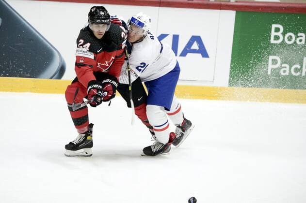 Dylan Cozens (L) of Canada vies with Romain Bault of France during the 2022 IIHF Ice hockey, Eishockey World Championships preliminary round group A match between Canada and France in Helsinki on May 24, 2022. Helsinki Finland LKFTVX20220524211745BCEY  Copyright: xMikkoxStigx