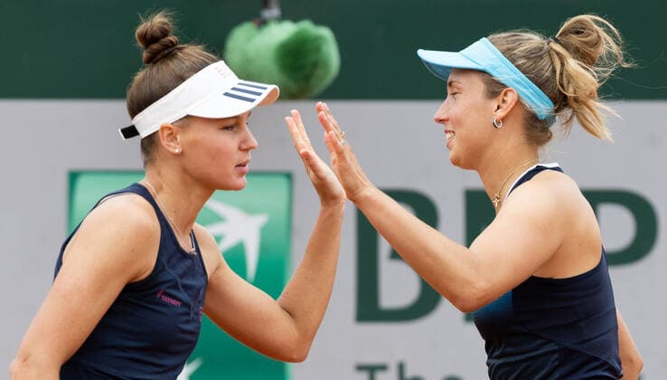 Russian Veronika Kudermetova and Belgian Elise Mertens give a high five as they celebrate scoring, during a tennis match between Belgian-Russian pair Mertens-Kudermetova against Croatian-American pair Martic-Rogers, in the first round of the women s doubles tournament, at the Roland Garros French Open tennis tournament, in Paris, France, Wednesday 25 May 2022. This year s tournament takes place from 22 May to 5 June. BENOITxDOPPAGNE  x35497158x