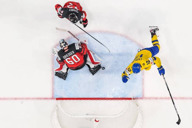 220526 Max Friberg of Sweden celebrates after scoring 3 0 while goaltender Chris Driedger and Thomas Chabot of Canada look dejected during the 2022 IIHF Ice Hockey World Championship quarterfinal game between Sweden and Canada on May 26, 2022 in Tampere Photo Maxim Thore BILDBYRAN kod MT MT0402 ishockey ice hockey ishockey vm iihf ice hockey world championship sverige sweden kanada canada bbeng kvartsfinal quarterfinal jubel depp,  Copyright: MAXIMxTHORE BB220526MT070