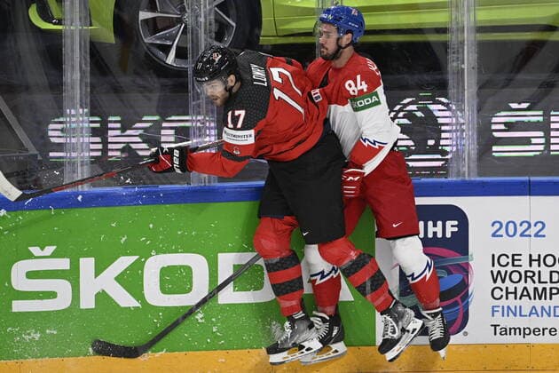 From left Adam Lowry of Canada and Czech Tomas Kundratek in action during the 2022 IIHF Ice hockey, Eishockey World Championship, WM, Weltmeisterschaft semifinals match Czech Republic vs. Canada, Tampere, Finland, May 28, 2022. (CTKxPhoto MichalxKamaryt) CTKPhotoP2022052803881 