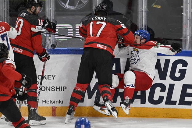 From right Czech Jiri Cernoch, Adam Lowry of Canada in action during the 2022 IIHF Ice hockey, Eishockey World Championship, WM, Weltmeisterschaft semifinals match Czech Republic vs. Canada, Tampere, Finland, May 28, 2022. (CTKxPhoto MichalxKamaryt) CTKPhotoP2022052804030 