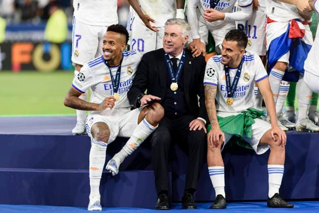 PARIS, FRANCE MAY 28 Real Madrid Head Coach Carlo Ancelotti C Eder Militao of Real Madrid CF L and Daniel Ceballos of Real Madrid CF R celebrating after winning Liverpool during the UEFA Champions League final match between Liverpool FC and Real Madrid at Stade de France on May 28, 2022 in Paris, France Paris Stade de France France  Copyright: xJustPictures.ch AdamxSobralx