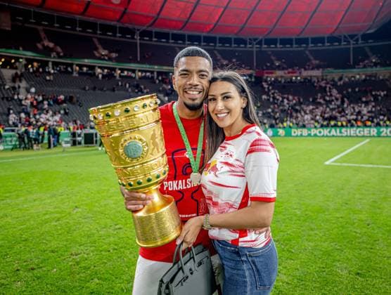 Leipzigs Benjamin Henrichs and his girlfriend Luana present the trophy after the match DFB Pokalfinale 2022 SC Freiburg RB Leipzig 2 4 i E 21 May 2022 Olympiastadion, Berlin SC Freiburg RB Leipzig 2 4 i E