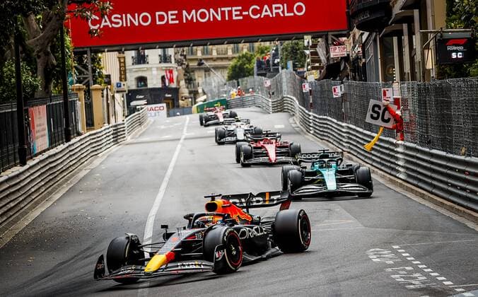 MONTE CARLO Max Verstappen 1 driving the Oracle Red Bull Racing RB18 Honda and Lance Stroll 18 driving the Aston Martin AMR22 during the Monaco F1 Grand Prix at Circuit de Monaco on May 29, 2022 in Monte Carlo, Monaco REMKO DE WAAL F1 Grand Prix of Monaco, RACE 2022 xVIxANPxSportx xxANPxIVx 449509655 originalFilename: 449509655.jpg