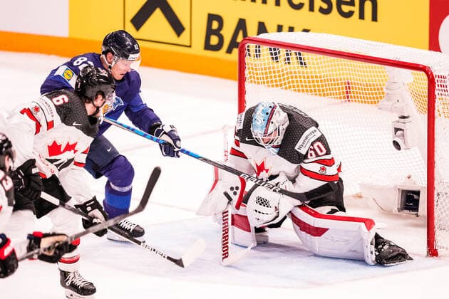 TAMPERE, FINLAND MAY 29 Harri Pesonen of Finland L against goalkeeper Chris Driedger of Canada R during the 2022 IIHF Ice Hockey World Championship match between Finland and Canada at Nokia Arena on May 29, 2022 in Tampere, Finland Tampere Nokia Arena Finland  Copyright: xJustPictures.ch JarixPestelaccix