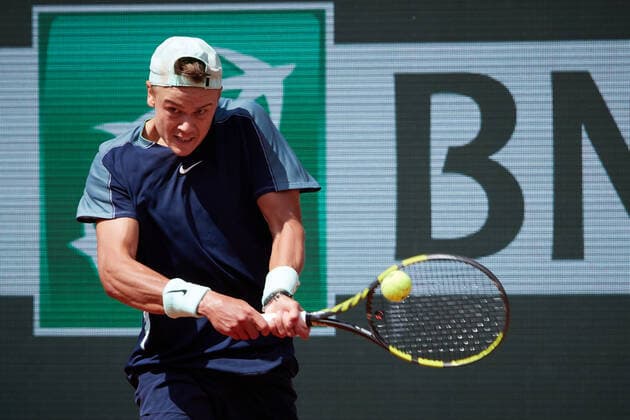 (220530) -- PARIS, May 30, 2022 -- Holger Rune of Denmark returns the ball during the men s singles fourth round match against Stefanos Tsitsipas of Greece at the French Open tennis tournament at Roland Garros in Paris, France, May 30, 2022. ) (SP)FRANCE-PARIS-TENNIS-ROLAND GARROS-FRENCH OPEN-MEN S SINGLES MengxDingbo 