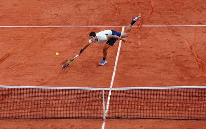Mandatory Credit: Photo by Javier Garcia Shutterstock (12960001bd) An off-balance Carlos Alcaraz manages to volley a winner to take it to 4-3 in the fourth set French Open Tennis, Day 10, Roland Garros, Paris, France - 31 May 2022 French Open Tennis, Day 10, Roland Garros, Paris, France - 31 May 2022  Copyright: xJavierxGarcia Shutterstockx 12960001bd