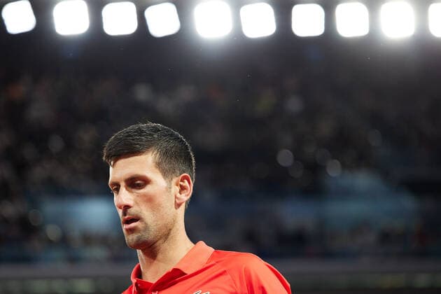 (220601) -- PARIS, June 1, 2022 -- Novak Djokovic reacts during the men s singles quarterfinal between Serbia s Novak Djokovic and Spain s Rafael Nadal at the French Open tennis tournament at Roland Garros in Paris, France, May 31, 2022. ) (SP)FRANCE-PARIS-TENNIS-ROLAND GARROS-FRENCH OPEN-MEN S SINGLES QUARTERFINAL MengxDingbo 