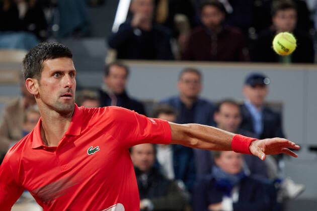 (220601) -- PARIS, June 1, 2022 -- Novak Djokovic return a shot during the men s singles quarterfinal between Serbia s Novak Djokovic and Spain s Rafael Nadal at the French Open tennis tournament at Roland Garros in Paris, France, May 31, 2022. ) (SP)FRANCE-PARIS-TENNIS-ROLAND GARROS-FRENCH OPEN-MEN S SINGLES QUARTERFINAL MengxDingbo 