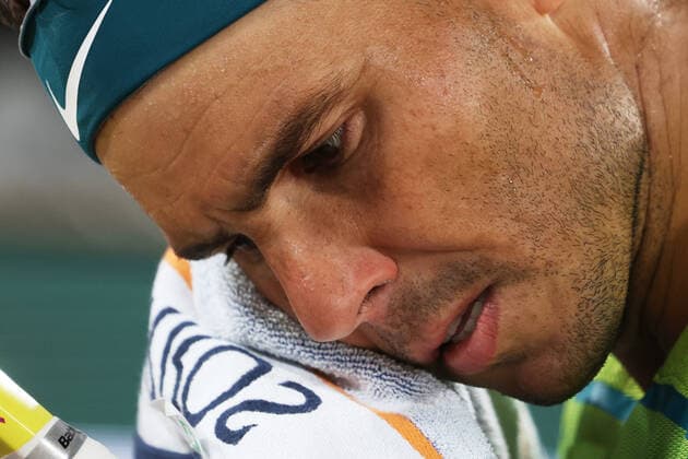 (220601) -- PARIS, June 1, 2022 -- Rafael Nadal reacts during the men s singles quarterfinal between Serbia s Novak Djokovic and Spain s Rafael Nadal at the French Open tennis tournament at Roland Garros in Paris, France, June 1, 2022. ) (SP)FRANCE-PARIS-TENNIS-ROLAND GARROS-FRENCH OPEN-MEN S SINGLES QUARTERFINAL MengxDingbo 
