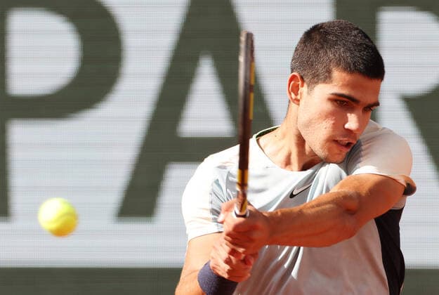 (220601) -- PARIS, June 1, 2022 -- Carlos Alcaraz returns the ball during the men s singles quarterfinal between Germany s Alexander Zverev and Spain s Carlos Alcaraz at the French Open tennis tournament at Roland Garros in Paris, France, May 31, 2022. ) (SP)FRANCE-PARIS-TENNIS-ROLAND GARROS-FRENCH OPEN-MEN S SINGLES QUARTERFINAL GaoxJing 