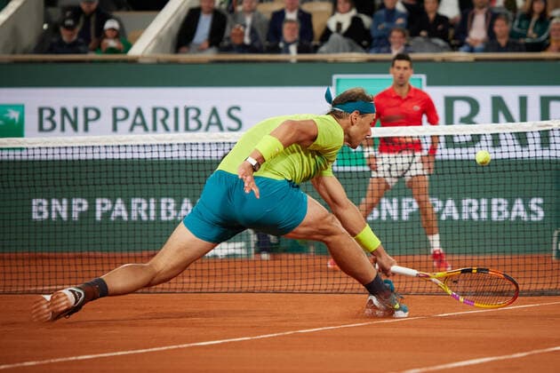 (220601) -- PARIS, June 1, 2022 -- Rafael Nadal returns a shot during the men s singles quarterfinal between Serbia s Novak Djokovic and Spain s Rafael Nadal at the French Open tennis tournament at Roland Garros in Paris, France, June 1, 2022. ) (SP)FRANCE-PARIS-TENNIS-ROLAND GARROS-FRENCH OPEN-MEN S SINGLES QUARTERFINAL MengxDingbo 