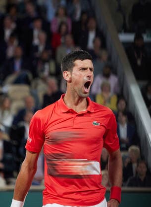 (220601) -- PARIS, June 1, 2022 -- Novak Djokovic reacts during the men s singles quarterfinal between Serbia s Novak Djokovic and Spain s Rafael Nadal at the French Open tennis tournament at Roland Garros in Paris, France, May 31, 2022. ) (SP)FRANCE-PARIS-TENNIS-ROLAND GARROS-FRENCH OPEN-MEN S SINGLES QUARTERFINAL MengxDingbo 