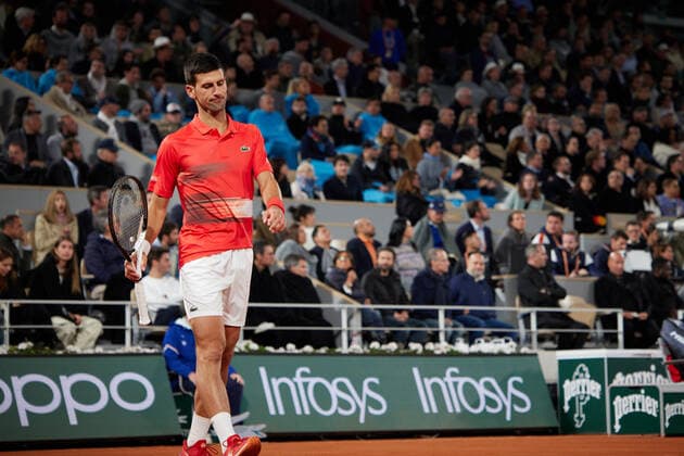 (220601) -- PARIS, June 1, 2022 -- Novak Djokovic reacts during the men s singles quarterfinal between Serbia s Novak Djokovic and Spain s Rafael Nadal at the French Open tennis tournament at Roland Garros in Paris, France, June 1, 2022. ) (SP)FRANCE-PARIS-TENNIS-ROLAND GARROS-FRENCH OPEN-MEN S SINGLES QUARTERFINAL MengxDingbo 