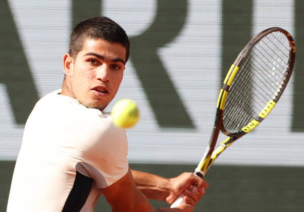 (220601) -- PARIS, June 1, 2022 -- Carlos Alcaraz returns the ball during the men s singles quarterfinal between Germany s Alexander Zverev and Spain s Carlos Alcaraz at the French Open tennis tournament at Roland Garros in Paris, France, May 31, 2022. ) (SP)FRANCE-PARIS-TENNIS-ROLAND GARROS-FRENCH OPEN-MEN S SINGLES QUARTERFINAL GaoxJing 