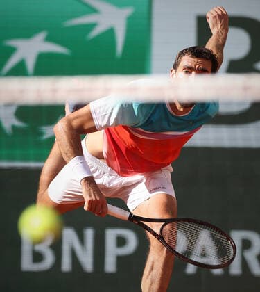 (220602) -- PARIS, June 2, 2022 -- Marin Cilic serves the ball during the men s singles quarterfinal between Marin Cilic of Croatia and Andrey Rublev of Russia at the French Open tennis tournament at Roland Garros in Paris, France, June 1, 2022. ) (SP)FRANCE-PARIS-TENNIS-ROLAND GARROS-FRENCH OPEN-MEN S SINGLES QUARTERFINAL MengxDingbo 