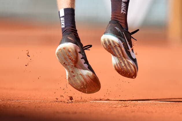 (220602) -- PARIS, June 2, 2022 -- The shoes of Andrey Rublev are seen during the men s singles quarterfinal between Marin Cilic of Croatia and Andrey Rublev of Russia at the French Open tennis tournament at Roland Garros in Paris, France, June 1, 2022. ) (SP)FRANCE-PARIS-TENNIS-ROLAND GARROS-FRENCH OPEN-MEN S SINGLES QUARTERFINAL MengxDingbo 