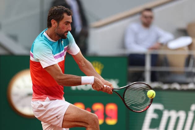 (220602) -- PARIS, June 2, 2022 -- Marin Cilic returns a shot during the men s singles quarterfinal between Marin Cilic of Croatia and Andrey Rublev of Russia at the French Open tennis tournament at Roland Garros in Paris, France, June 1, 2022. ) (SP)FRANCE-PARIS-TENNIS-ROLAND GARROS-FRENCH OPEN-MEN S SINGLES QUARTERFINAL MengxDingbo 