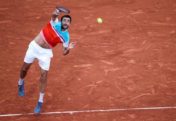 Marin Cilic of Croatia returns the ball to Norway s Casper Ruud during their semi-final match of the French Tennis Open at Roland Garros near Paris, France, on Friday, June 3, 2022. Ruud won 3-6, 6-4, 6-2, 6-2 and qualified for Sunday s final.  PAR20220603151 MAYAxVIDON-WHITE