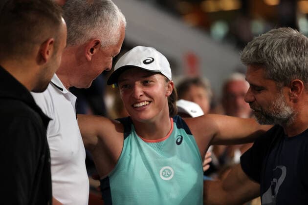 Iga Swiatek of Poland is congratulated by her coaches after her victory against US Coco Gauff at the end of their final match at the French Tennis Open in Roland Garros near Paris, France, on Saturday, June 4, 2022. Swiatek won the title 6-1, 6-3.  PAR20220604131 MAYAxVIDON-WHITE